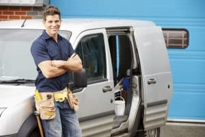 mesa plumber standing next to van